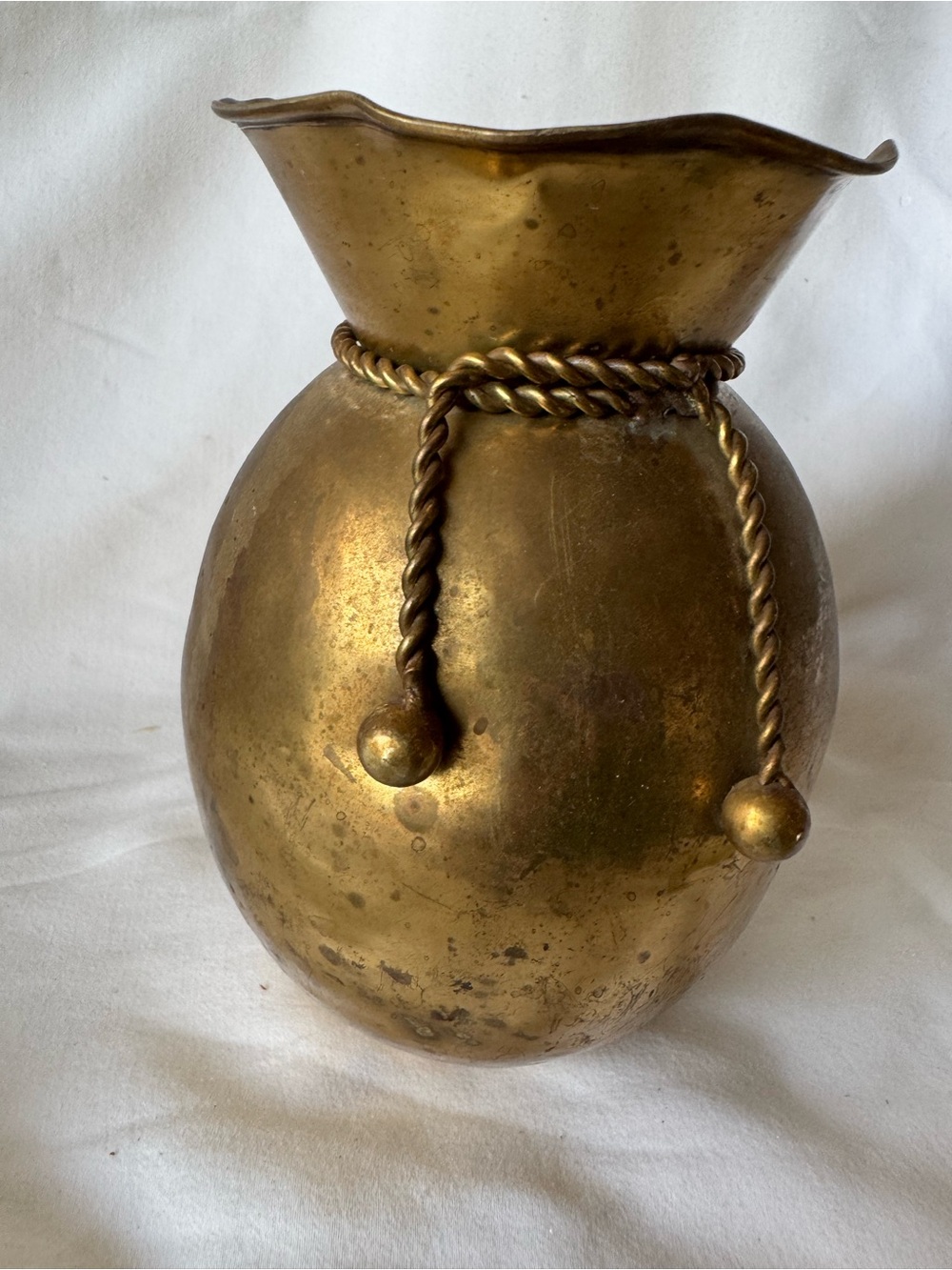 vintage solid brass vase from India featuring a distinctive ruffled rim and a de